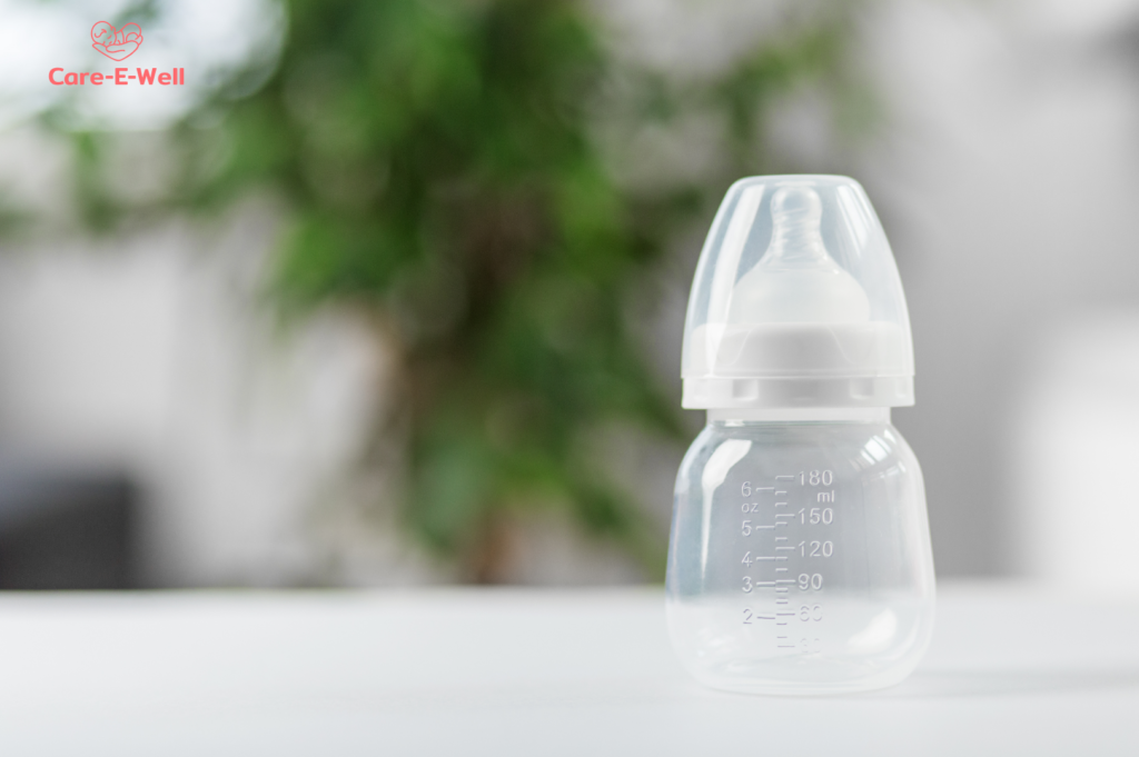 Parent breastfeeding a newborn while receiving support for concerns about low milk supply